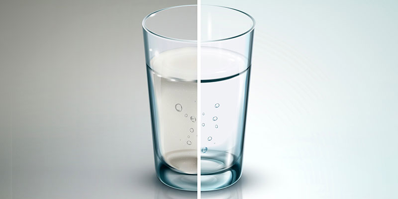 Glass Half Full of Dirty Water and Half Full of Clean Water