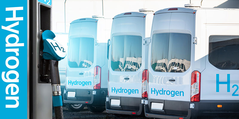 Self-Service Hydrogen Filling Station on Background of Vans
