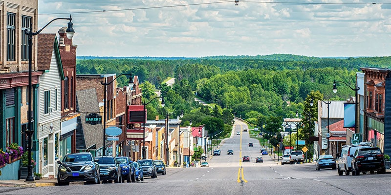 Main Street With Buildings in Small Hilltop Town