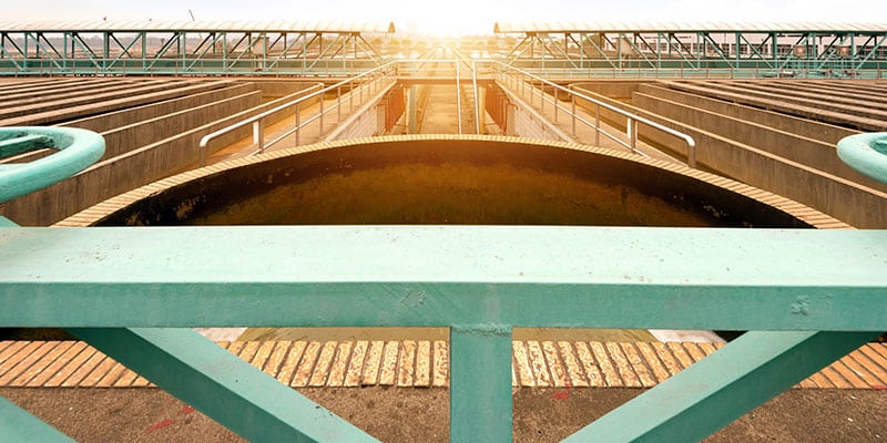 Sun Shines Behind a Modern Wastewater Treatment Plant
