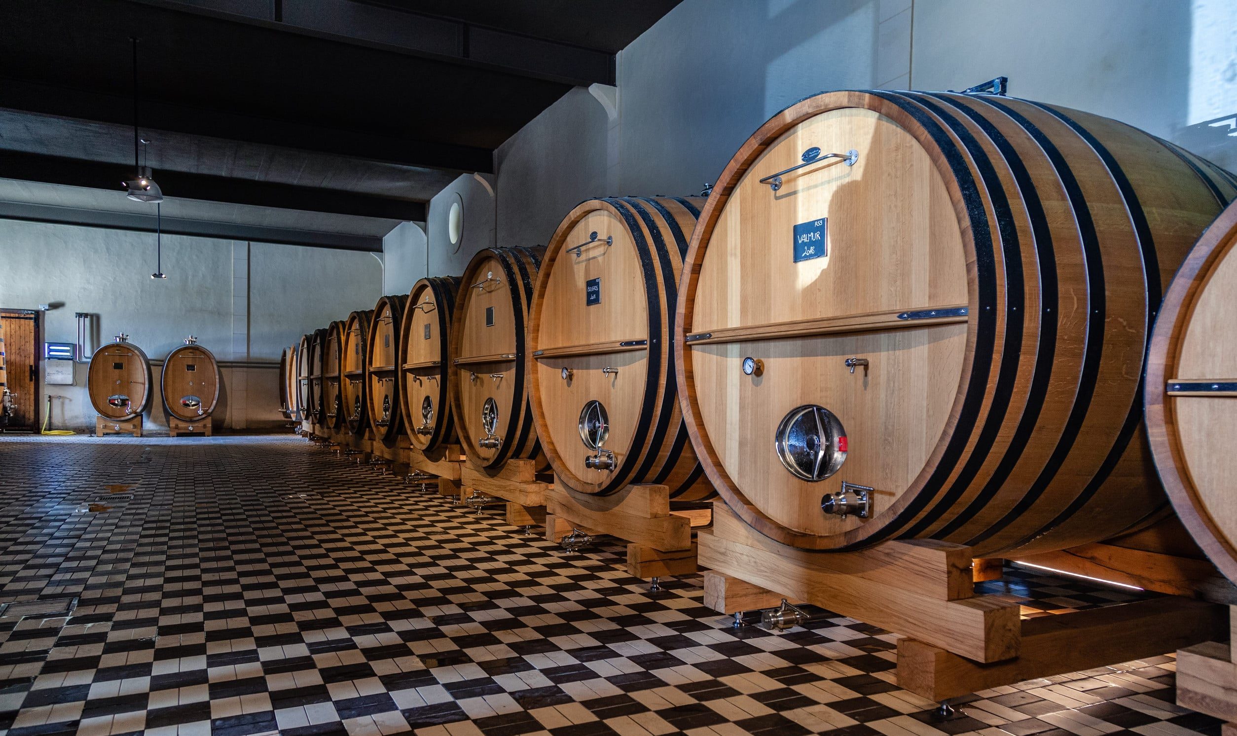 Wine Is Stored in Large Barrels at a Winery