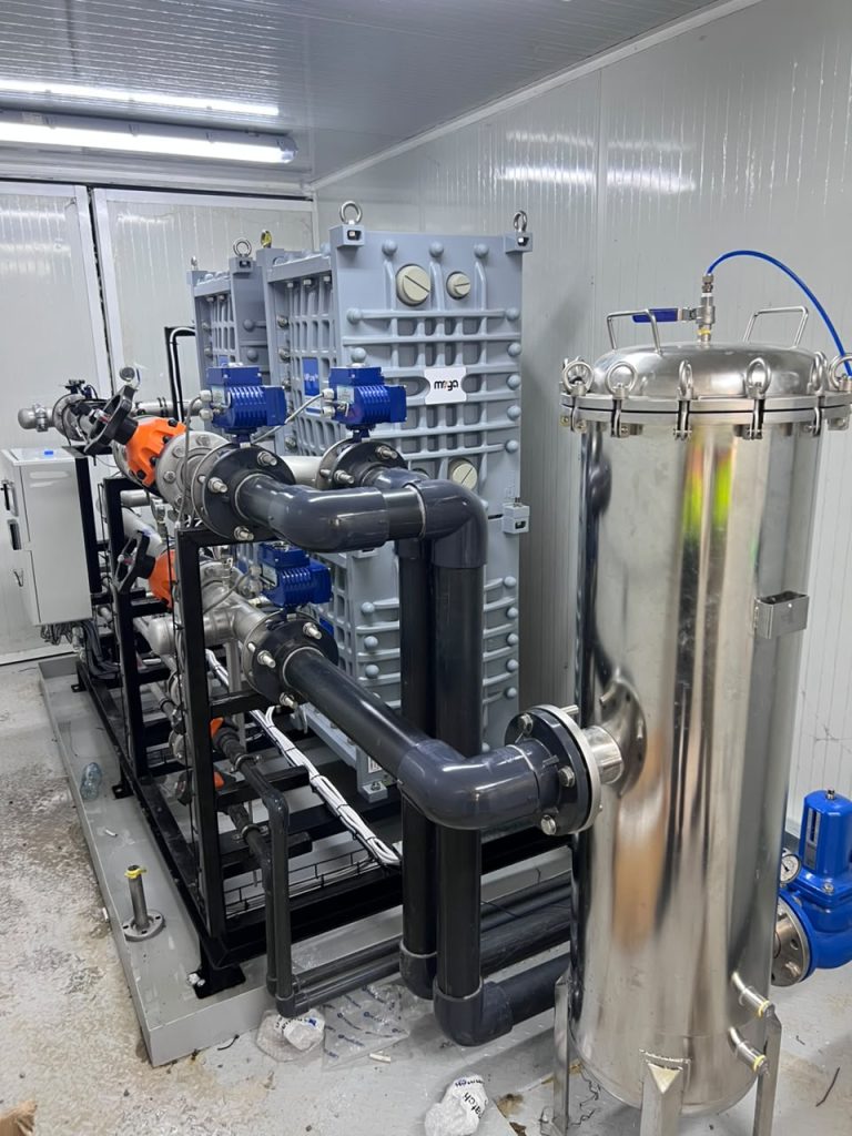 Fluence water treatment system with membrane equipment, pumps, piping, and filtration vessel inside a modular treatment unit.